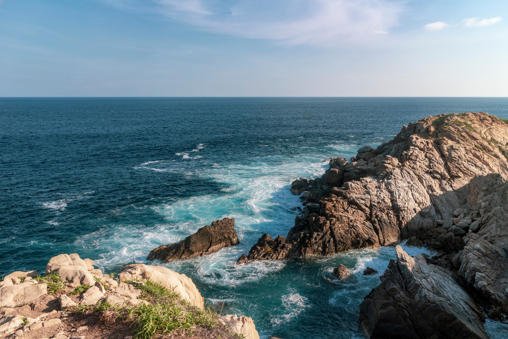 Brown Rocky Shore Under Blue Sky